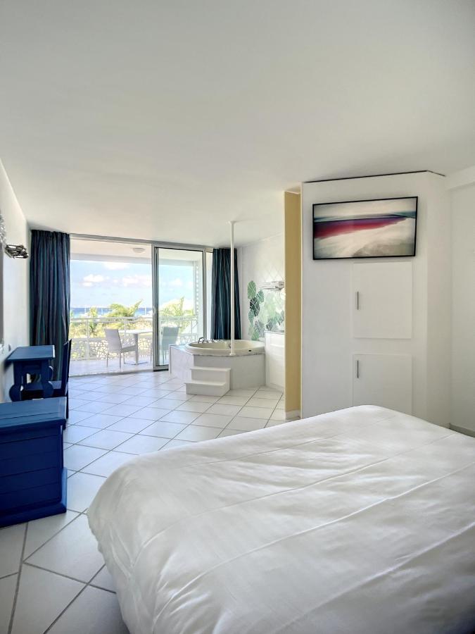 Le Domaine Anse Marcel Beach Resort Esterno foto